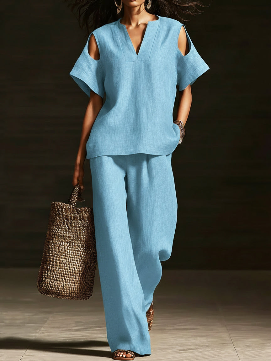 Set di due pezzi elegante con top off-the-shoulder e pantaloni a gamba larga