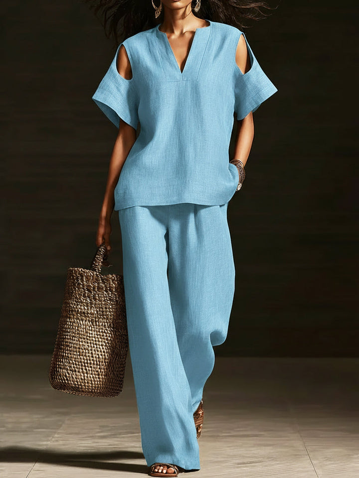 Set di due pezzi elegante con top off-the-shoulder e pantaloni a gamba larga
